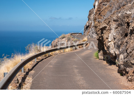 mountain road along the coast of the la palma island 60087504
