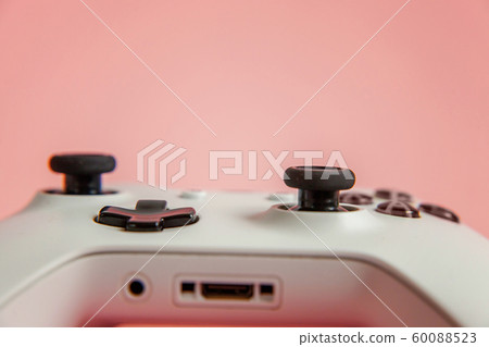 White joystick on pink background. Computer gaming 60088523