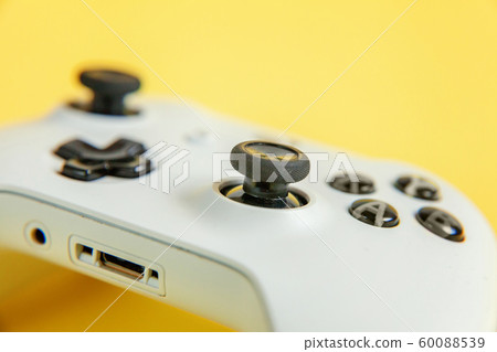 White joystick on yellow background. Computer White joystick on yellow background. Computer 60088539