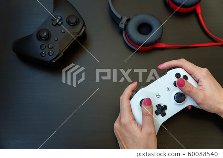 Woman hand holding white joystick isolated on Woman hand holding white joystick isolated on 60088540