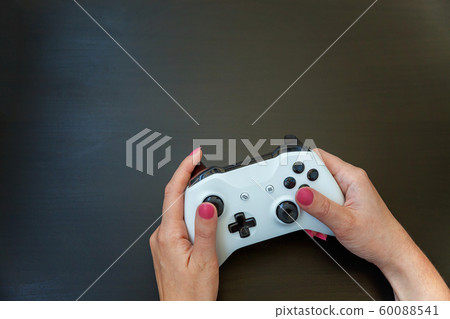 Woman hand holding white joystick isolated on Woman hand holding white joystick isolated on 60088541