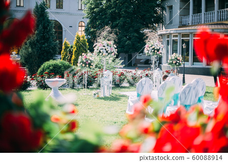 Beautiful wedding day ceremony set up. Outdoor. 60088914