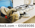 washed clean different dishes in the kitchen 60089086