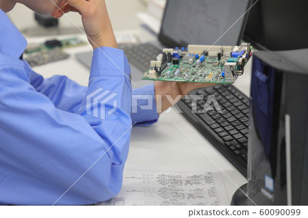 Engineers checking the board and mounting diagram1 Engineers checking the board and mounting diagram1 60090099
