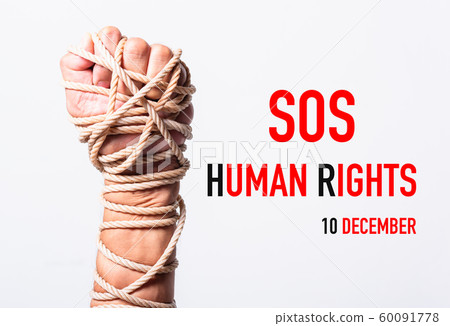 Rope on fist hand with SOS HUMAN RIGHTS DAY 10 60091778