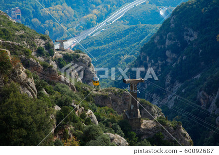 Montserrat rock formations and sea of clouds, ropeway 60092687