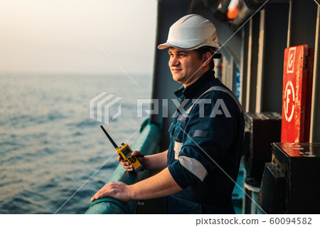 Marine Deck Officer or Chief mate on deck of offshore vessel or ship , wearing PPE personal Marine Deck Officer or Chief mate on deck of offshore vessel or ship , wearing PPE personal 60094582