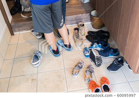Entrance full of shoes Entrance full of shoes 60095997