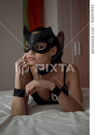 Brunette girl in a cat mask 60097693