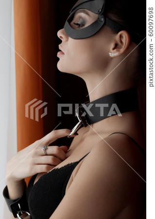 Brunette girl in a cat mask 60097698