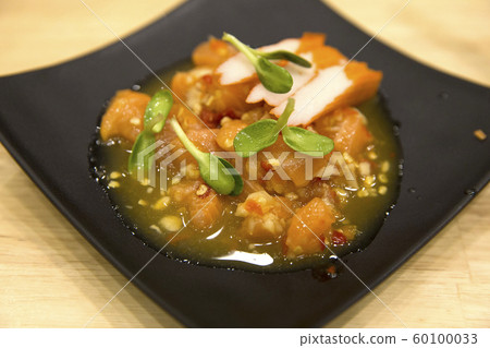 Fresh Salmon Sashimi salad focus selective. Fresh Salmon Sashimi salad focus selective. 60100033