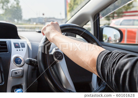 Young woman driving Young woman driving 60101628