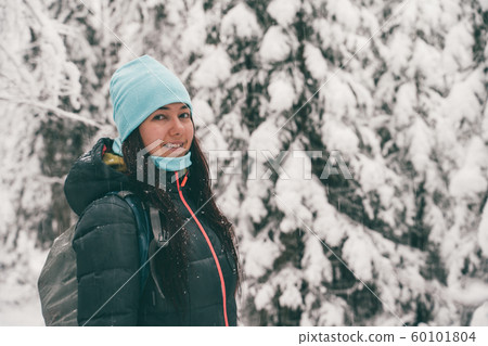 Image of tourist woman walking in winter forest. Image of tourist woman walking in winter forest. 60101804