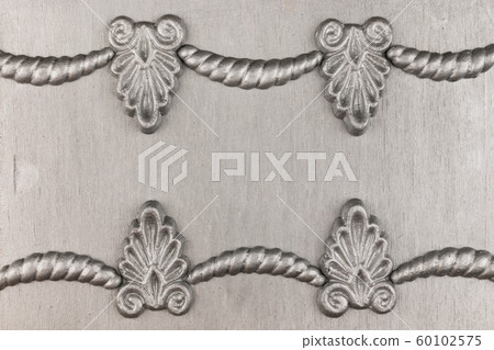 Luxury frame made of silver stucco plaster lying on silver surface. Luxury frame made of silver stucco plaster lying on silver surface. 60102575