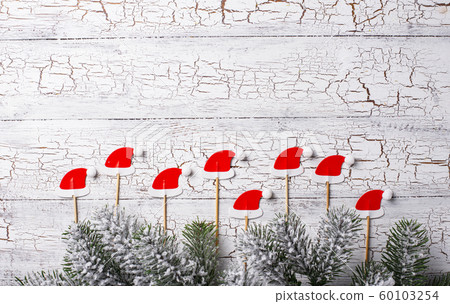 Christmas background with decorative Santa hats Christmas background with decorative Santa hats 60103254