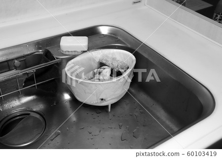 Garbage discarded in a triangular corner (monochrome) Garbage discarded in a triangular corner (monochrome) 60103419