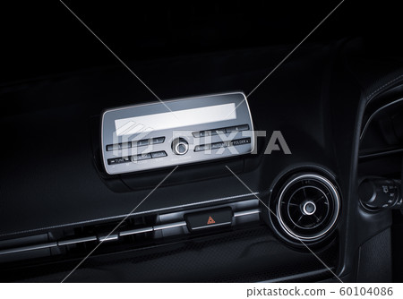 Audio multimedia player and radio on car console panel and emergency light button. 60104086