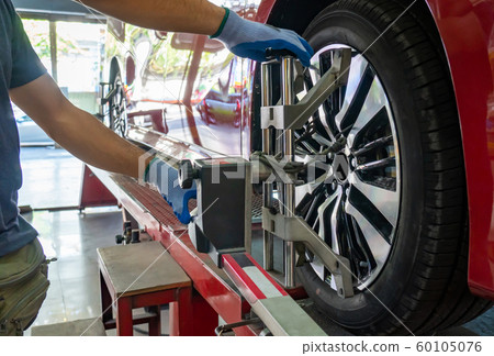 Wheel alignment of a vehicle in progress Wheel alignment of a vehicle in progress 60105076