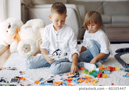 Children playing with lego in a playing room 60105447