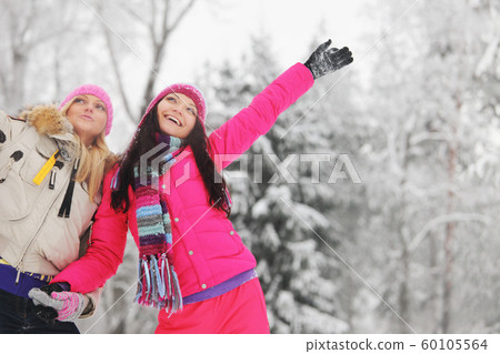 Happy girls at winter park Happy girls at winter park 60105564