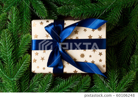Top view of New Year gift box decorated with fir Top view of New Year gift box decorated with fir 60106248