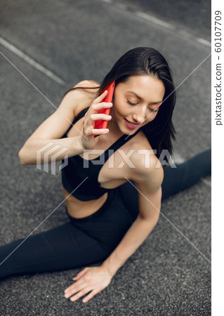 Sports girl training at the stadium Sports girl training at the stadium 60107709