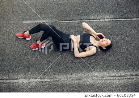 Sports girl training at the stadium Sports girl training at the stadium 60108354