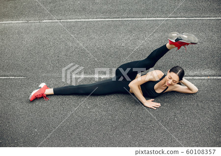 Sports girl training at the stadium Sports girl training at the stadium 60108357