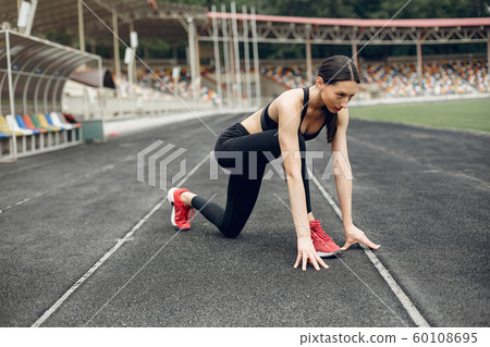 Sports girl training at the stadium 60108695