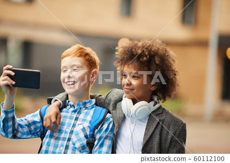 Selfie portrait of two friends 60112100