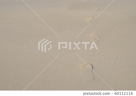 Footprints remaining on the beach Footprints remaining on the beach 60112118