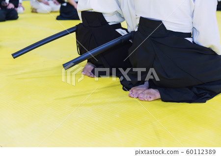 People in kimono on martial arts weapon training seminar People in kimono on martial arts weapon training seminar 60112389