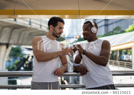 LGBT gay couple toast water after exercise LGBT gay couple toast water after exercise 60115021