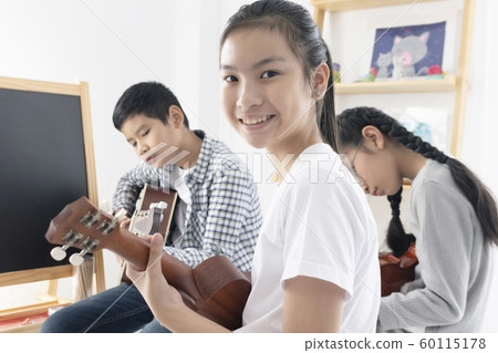 Young Asian girl teenager happy with playing Young Asian girl teenager happy with playing 60115178