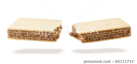 Waffle stick broken in half flying in the air on a Waffle stick broken in half flying in the air on a 60115733
