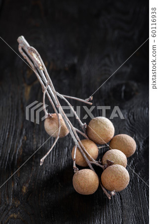 group longan fruits on a dark background 60116938