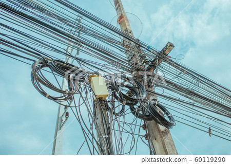 Wires on poles on the street in Asia, Thailand Wires on poles on the street in Asia, Thailand 60119290