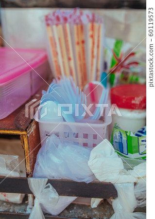 Plastic cutlery and bamboo sticks in Asia Plastic cutlery and bamboo sticks in Asia 60119573