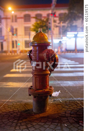 Old red Fire Hydrant on the Night street in Vietnam Old red Fire Hydrant on the Night street in Vietnam 60119575