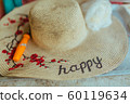 Patterned Straw hat on foam box in summer day 60119634