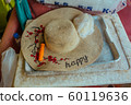 Patterned Straw hat on foam box in summer day 60119636