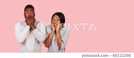 Stunned afro couple amazed by shocking news Stunned afro couple amazed by shocking news 60122298