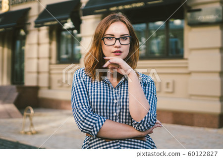 woman walking in dress in old city. Fashion Style Photo Of A Young Girl. happy stylish woman at old european city street. Tourist background of hotel. Man near building facade old european hotel 60122827