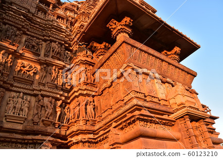 Khajuraho, India, World Heritage Khajuraho Temple, beautiful sculptures shining in the sunset Khajuraho, India, World Heritage Khajuraho Temple, beautiful sculptures shining in the sunset 60123210