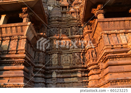 Khajuraho, India, World Heritage Khajuraho Temple, beautiful sculptures shining in the sunset 60123225