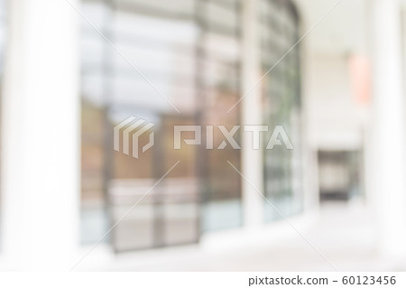 Blur office background building exterior view to lobby glass window wall with blurry light bokeh Blur office background building exterior view to lobby glass window wall with blurry light bokeh 60123456