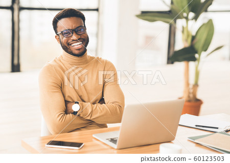 Portrait of confident african guy looking at camera Portrait of confident african guy looking at camera 60123503