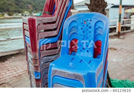 Plastic chairs on the street in summer Asia 60123610