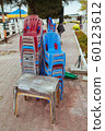 Plastic chairs on the street in summer Asia 60123612