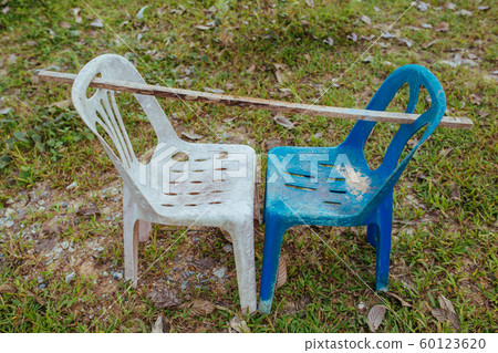 Plastic chairs on the street in summer Asia 60123620